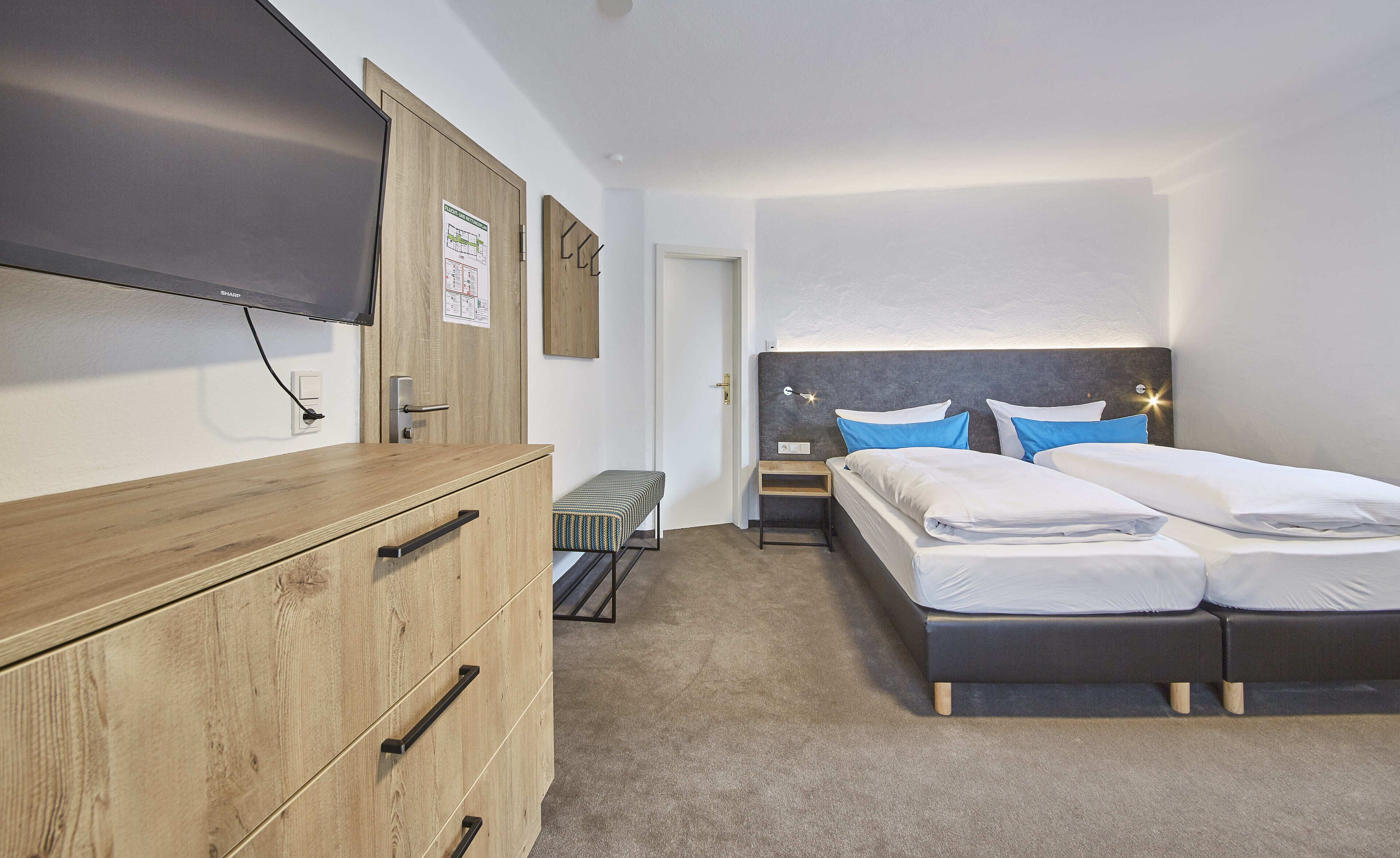deluxe double room | living area | flat-screen tv, heated floors