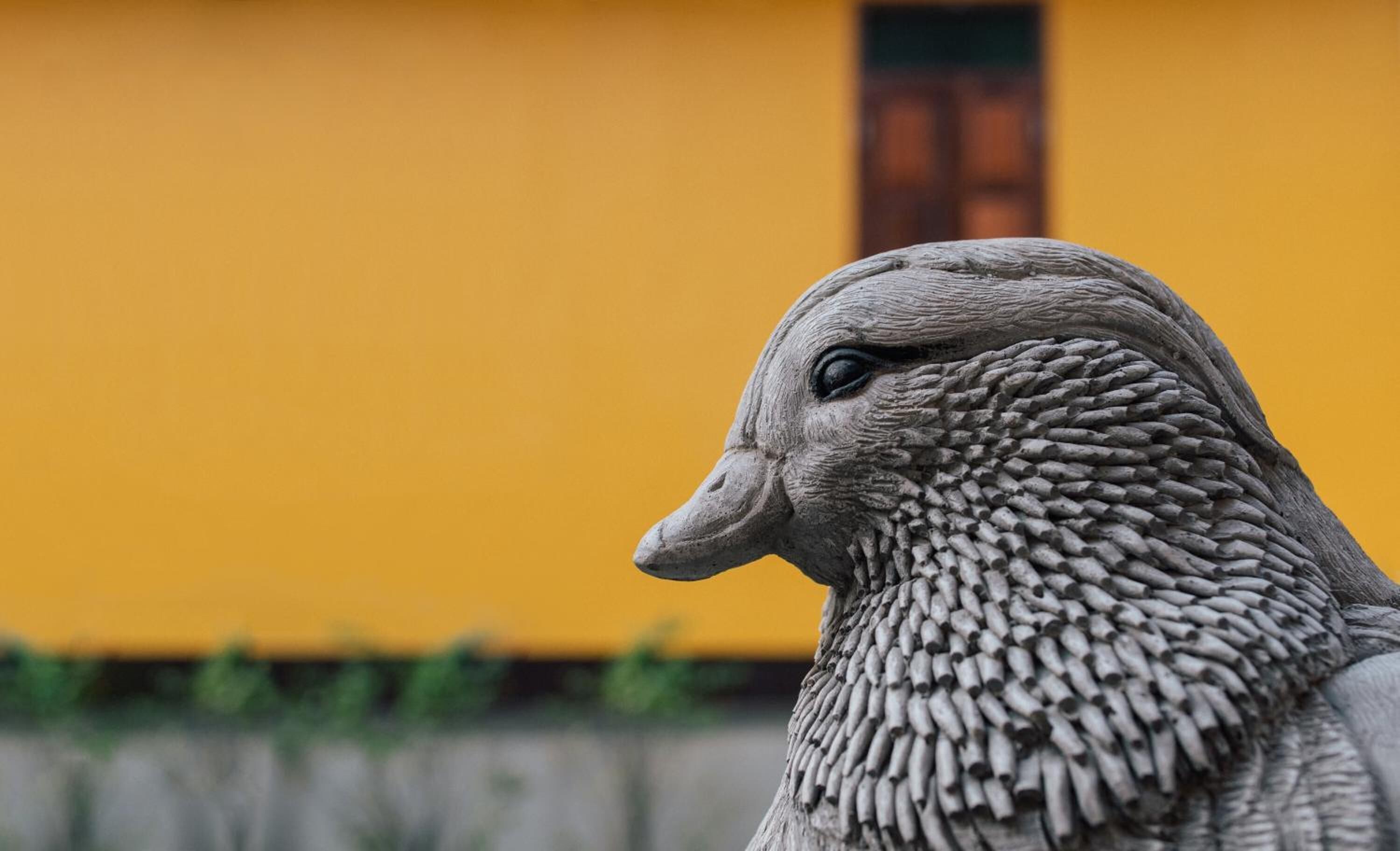 A sculpture of a duck with intricate textures.