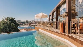 Indoor pool, outdoor pool, open 8:00 AM to 9:00 PM, pool umbrellas