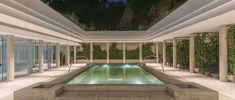 Indoor pool, seasonal outdoor pool, pool umbrellas, pool loungers