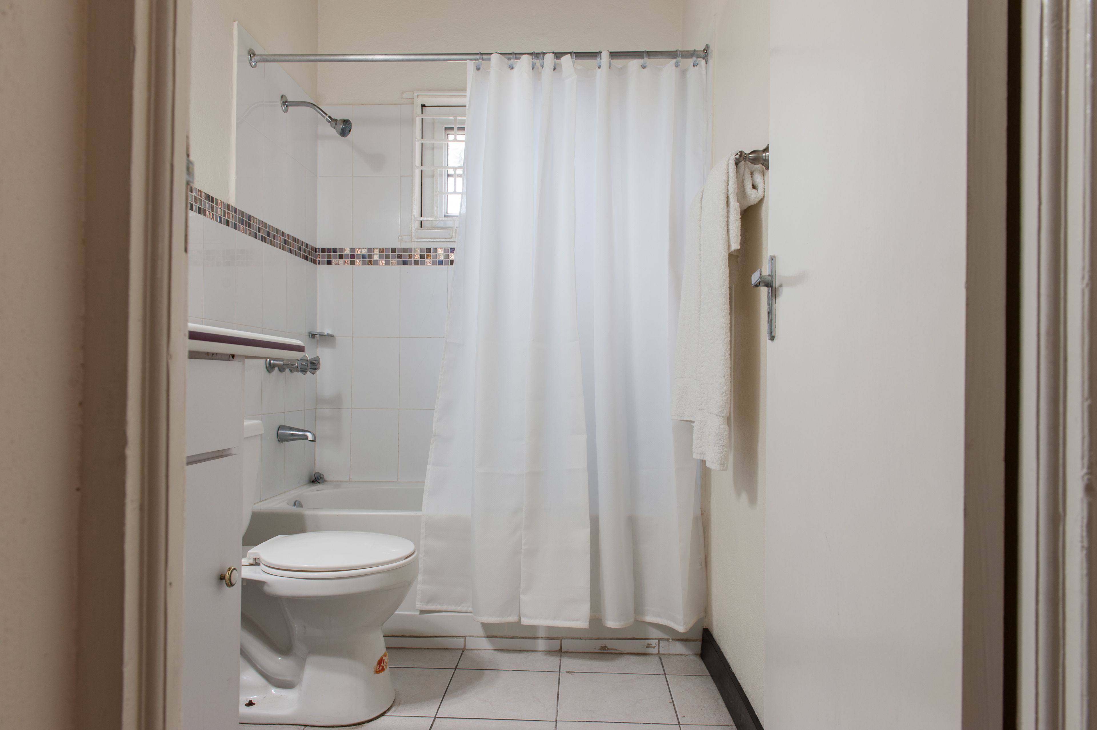 premium room, 2 queen beds, refrigerator | bathroom | towels, soap, toilet paper