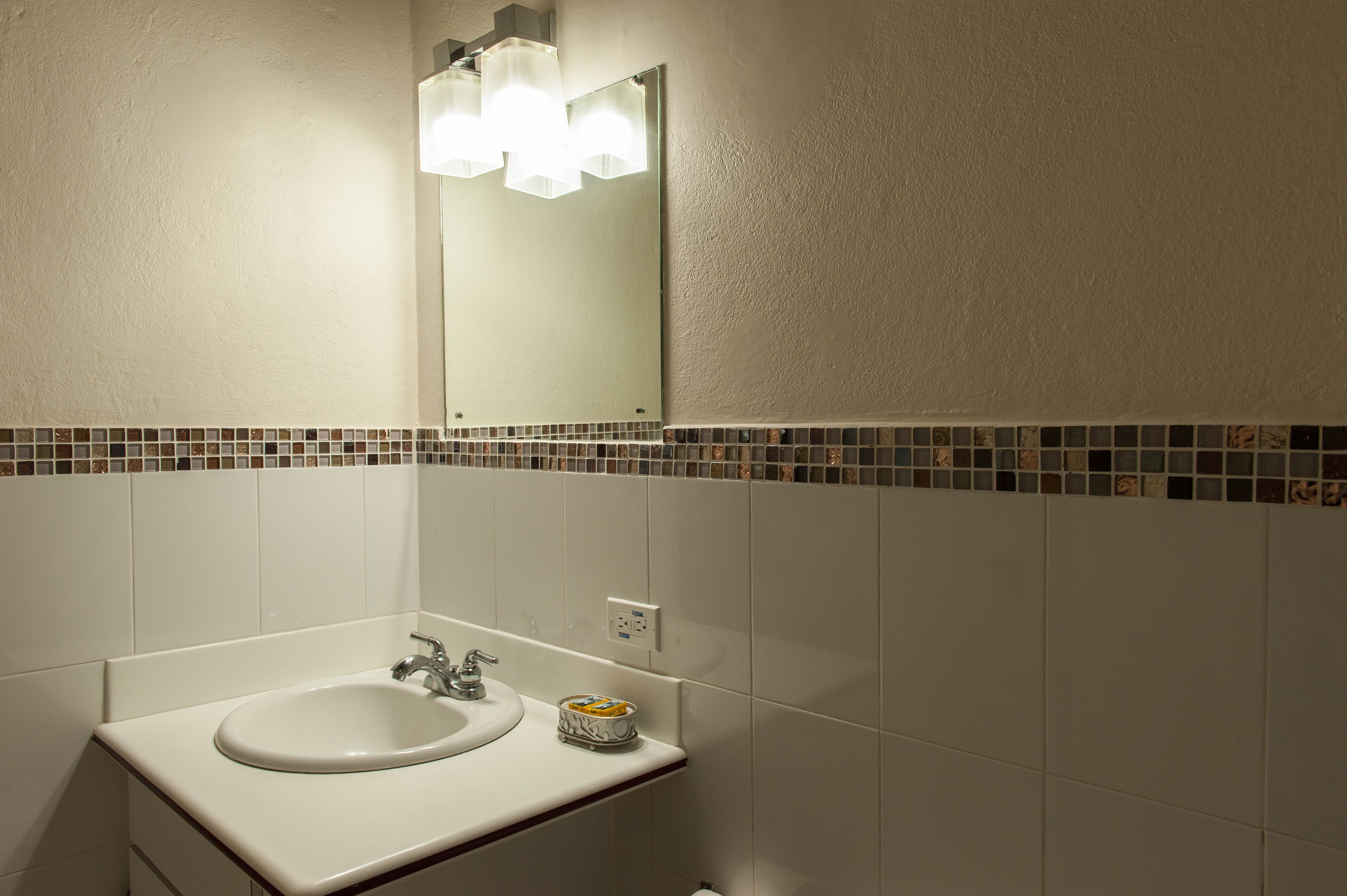 premium room, 2 queen beds, refrigerator | bathroom sink