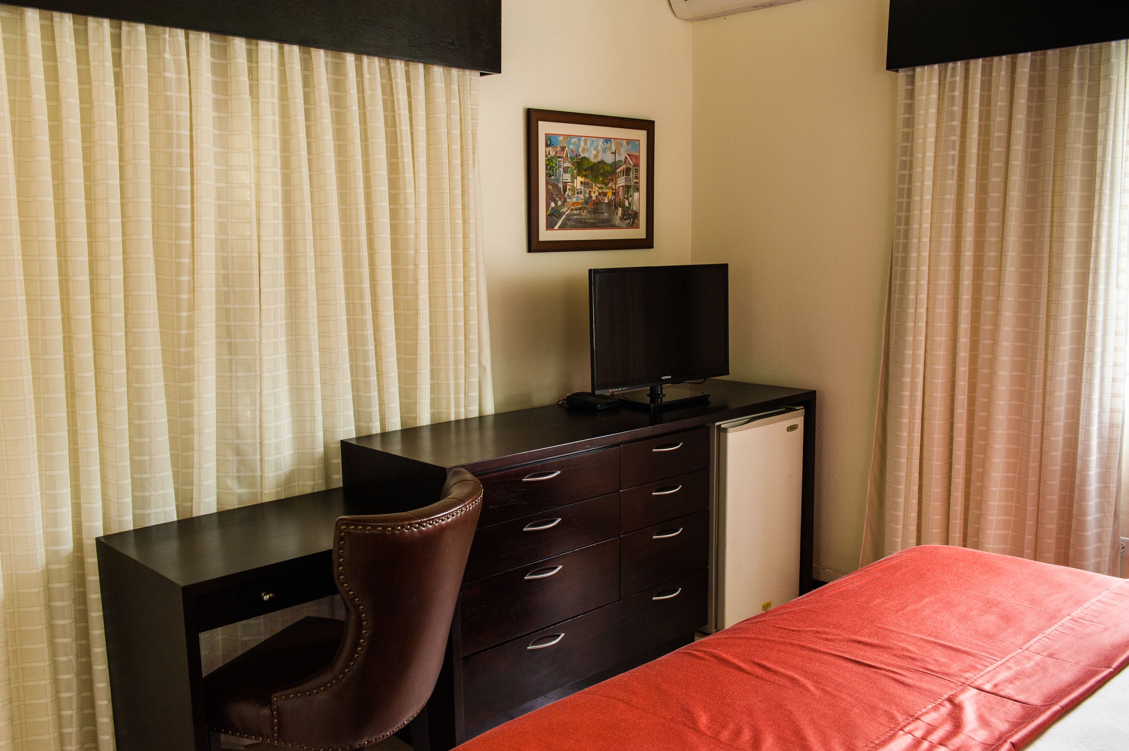 premium room, 1 king bed, refrigerator | room amenity