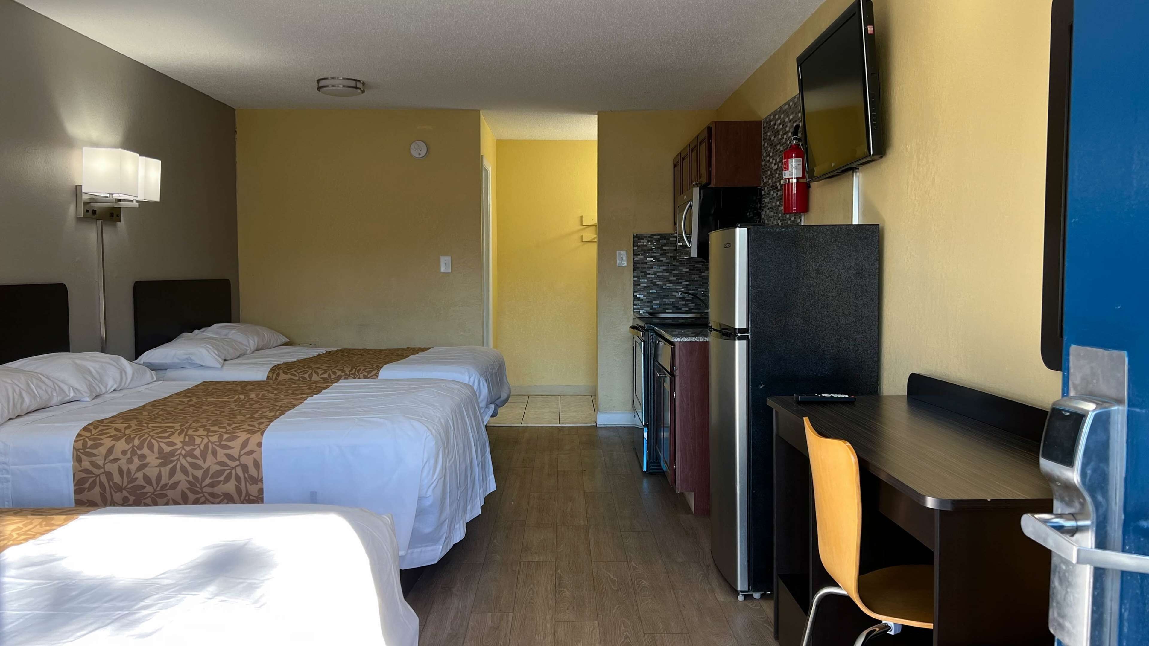 Standard Room, Multiple Beds, Non Smoking, Kitchenette | Blackout drapes, iron/ironing board, free WiFi, bed sheets