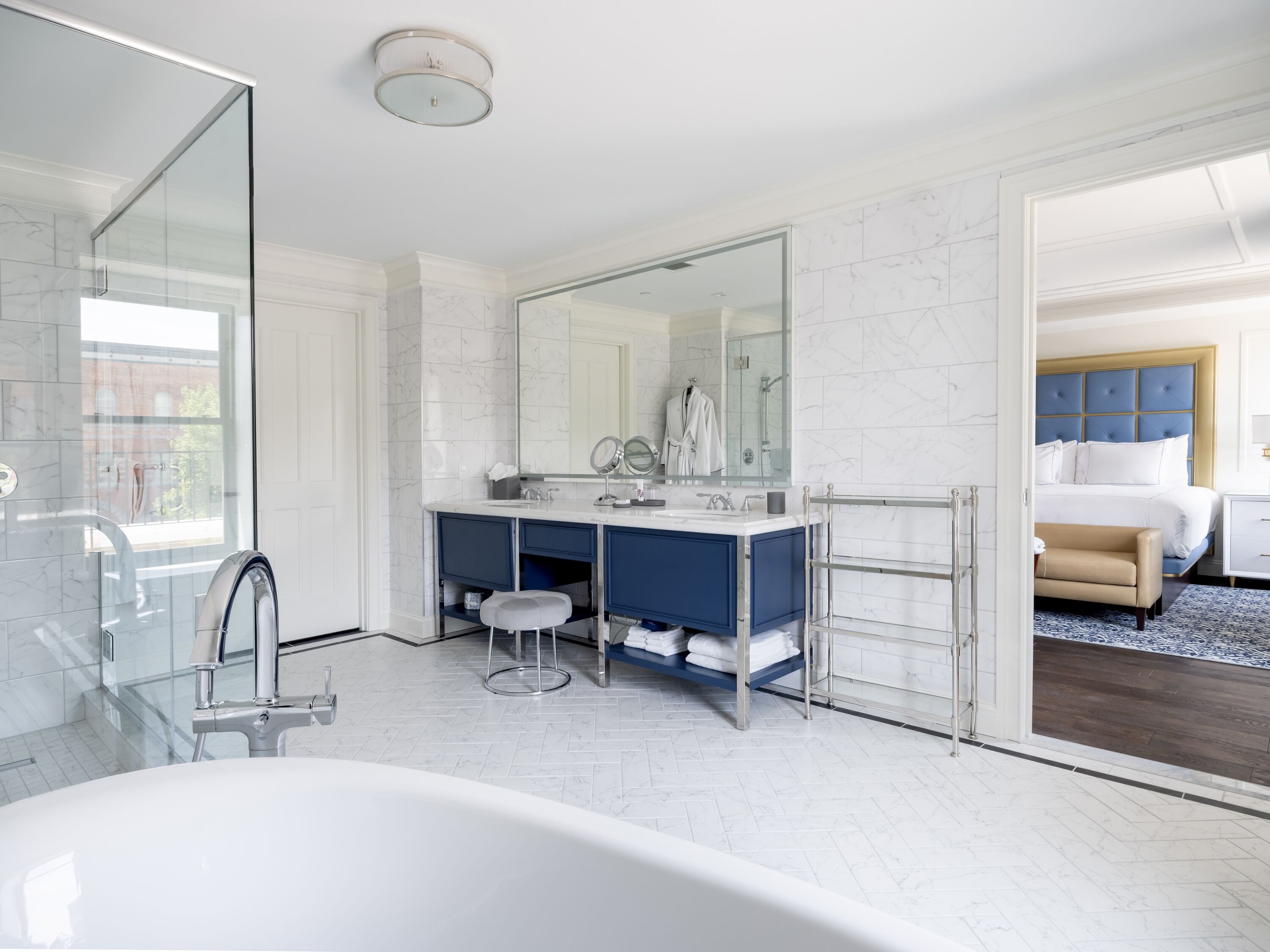 luxury room | bathroom | designer toiletries, hair dryer, bathrobes, slippers