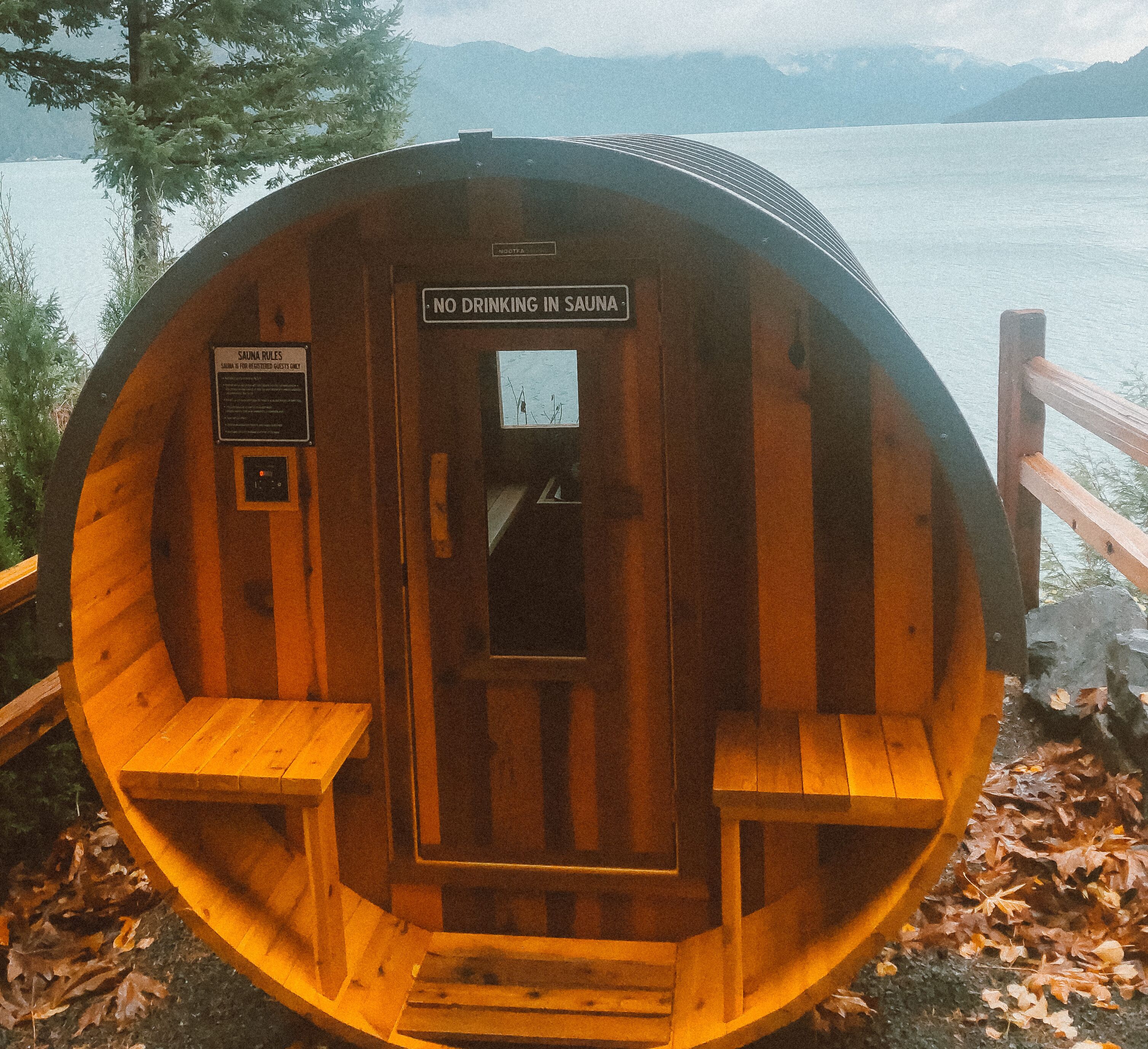 A sauna with a sign stating "No drinking in sauna."