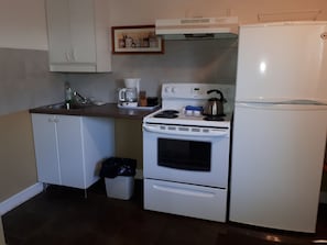 Suite, 2 chambres | Coin cuisine privé | Réfrigérateur, micro-ondes, cafetiÚre/bouilloire