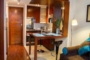 Superior Triple Room | Living area | Flat-screen TV - Plaza Town Santiago (Santiago)