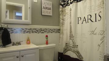 Bathtub, hair dryer, towels, soap