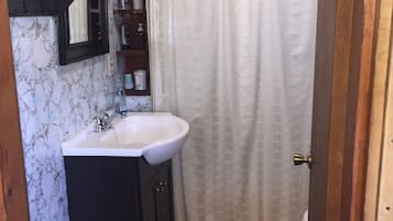 Combined shower/tub, hair dryer, towels, soap