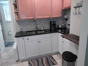 Fridge, microwave, stovetop, coffee/tea maker