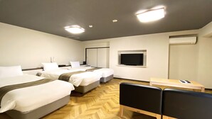 A hotel room with two beds, a desk, a chair, and a television. - Tennoji Lagoon Hotel (Osaka)