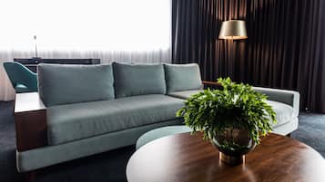 Corner Suite | Living area | 55-inch flat-screen TV with digital channels, TV