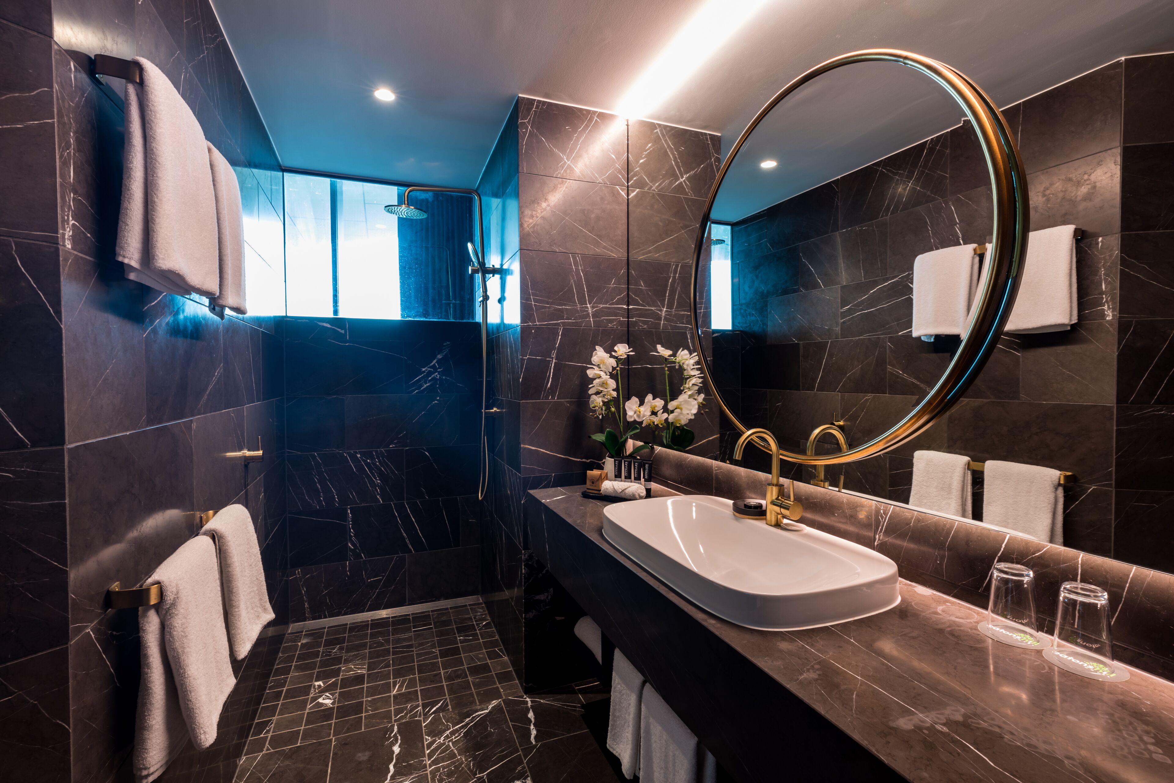 sky penthouse | bathroom | designer toiletries, hair dryer, towels