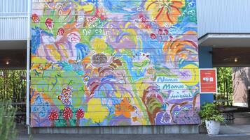 A colorful mural on a building's exterior wall.