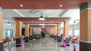 A spacious lobby with a polished floor, multiple seating areas, and a reception desk. - Sakura Budget Hotel (Hat Yai)
