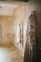Combined shower/tub, free toiletries, hair dryer, bathrobes