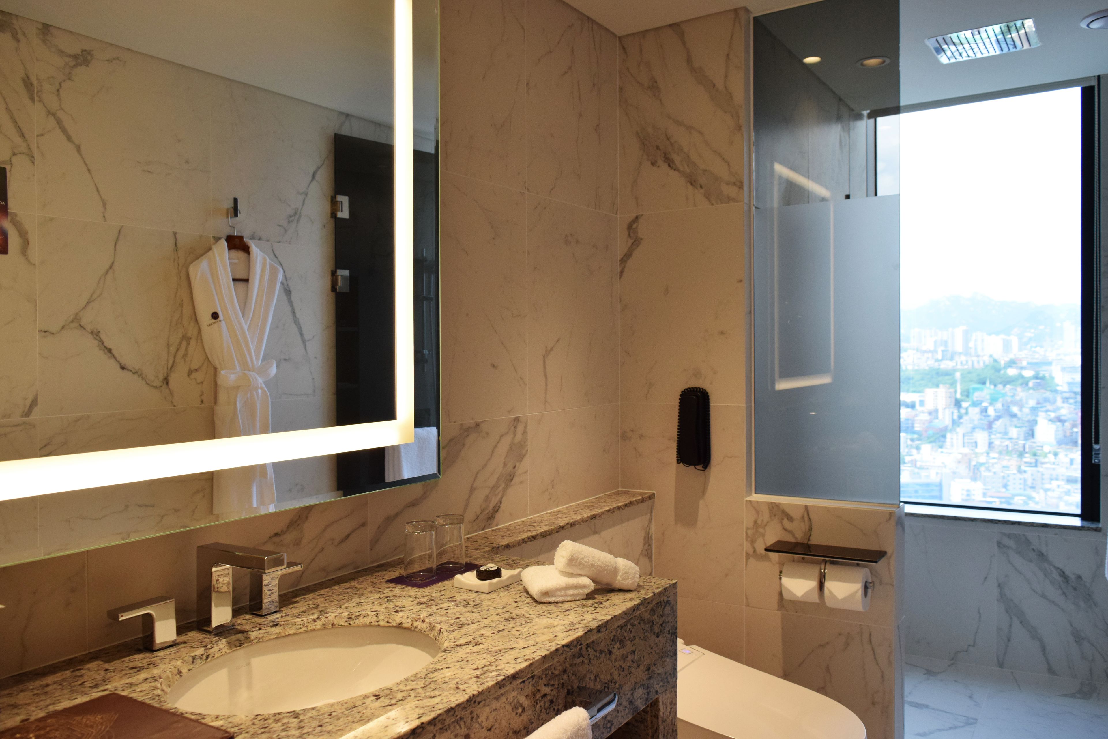 junior suite, 1 king bed | bathroom | designer toiletries, hair dryer, bathrobes, slippers