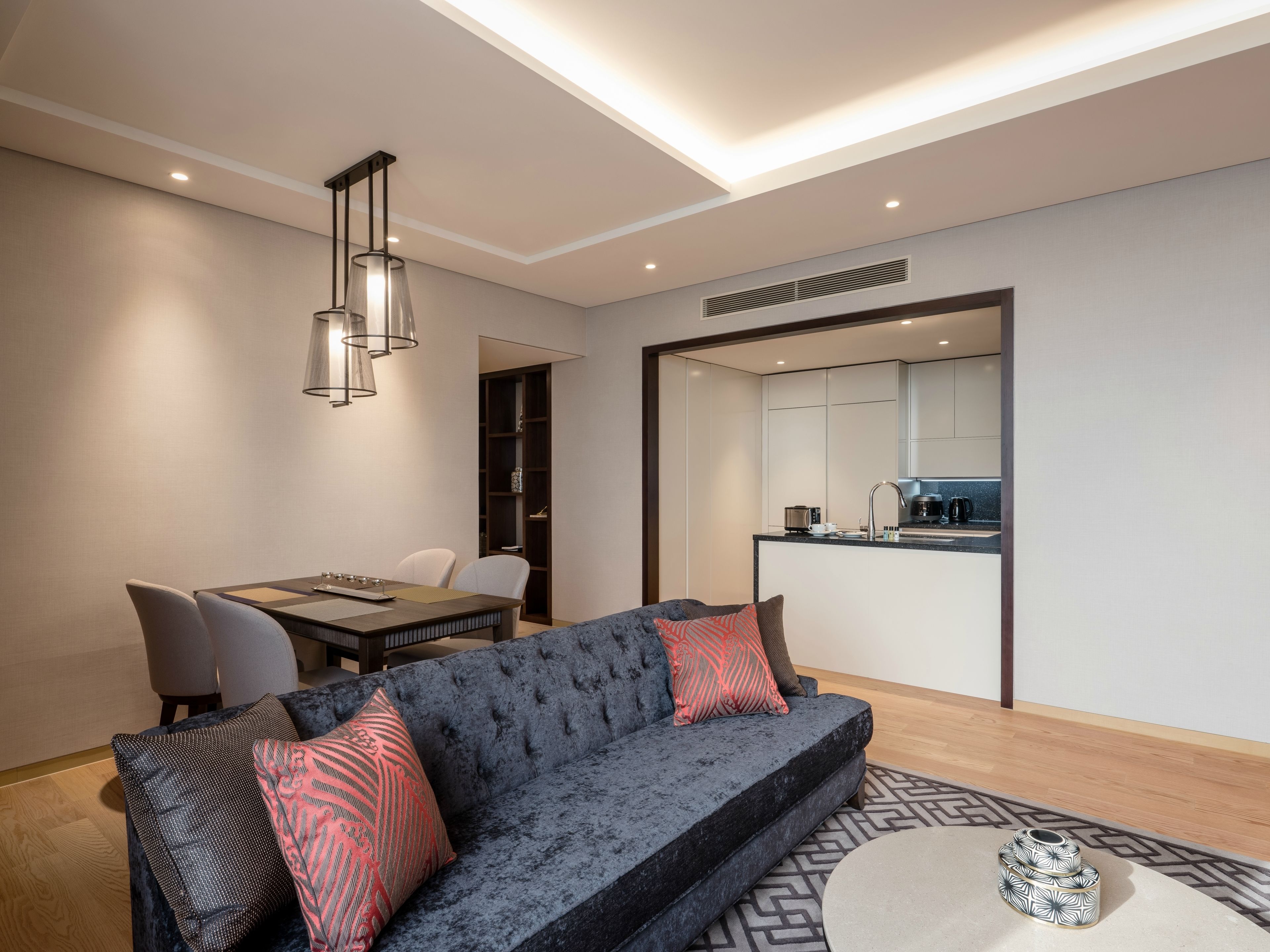 deluxe suite, 2 bedrooms | living room | 55-inch led tv with cable channels, tv, tablet