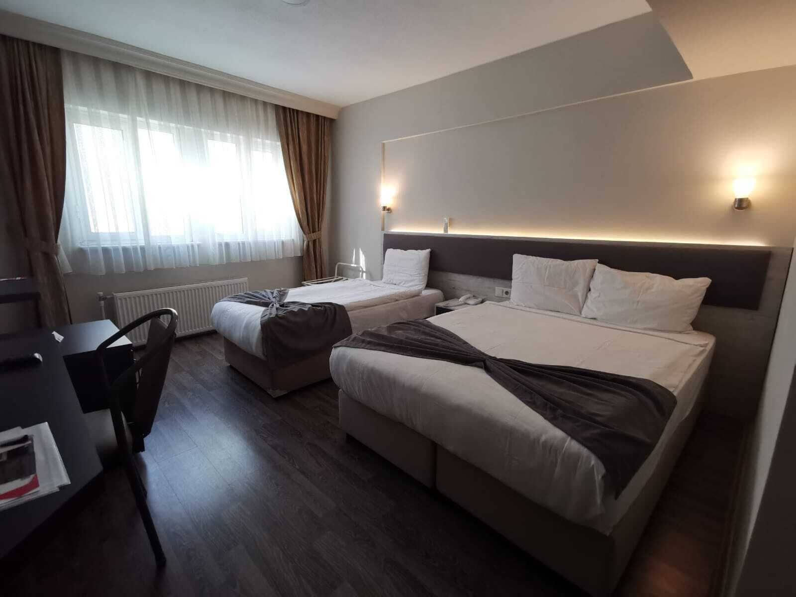 family triple room, multiple beds | desk, laptop workspace, soundproofing, free wifi