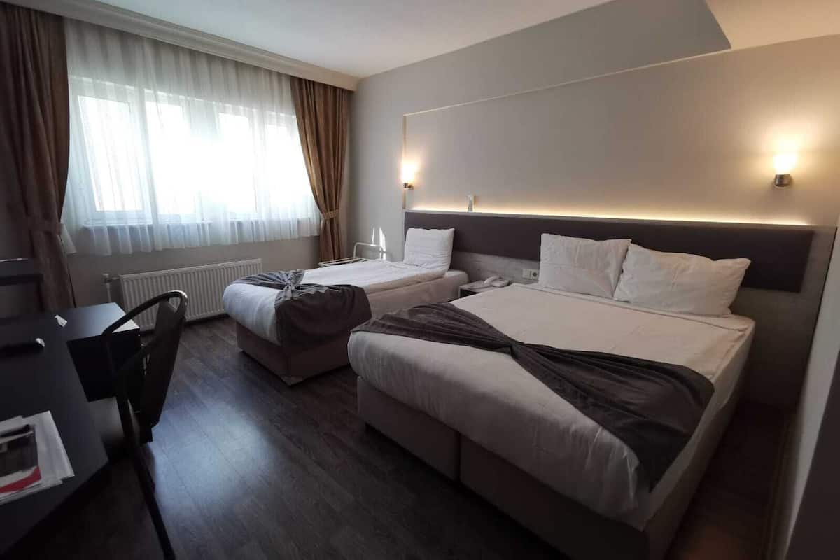 family triple room, multiple beds | desk, laptop workspace, soundproofing, free wifi