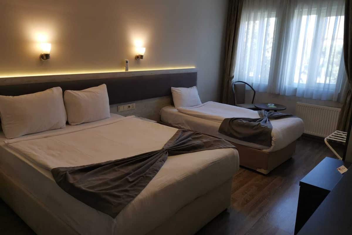 family triple room, multiple beds | desk, laptop workspace, soundproofing, free wifi