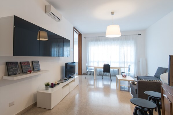 Apartment, 4 Bedrooms (Via Anastasio II, 167) | Living area | 40-inch flat-screen TV with digital channels, TV