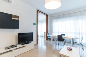 Apartment, 4 Bedrooms (Via Anastasio II, 167) | Living area | 40-inch flat-screen TV with digital channels, TV