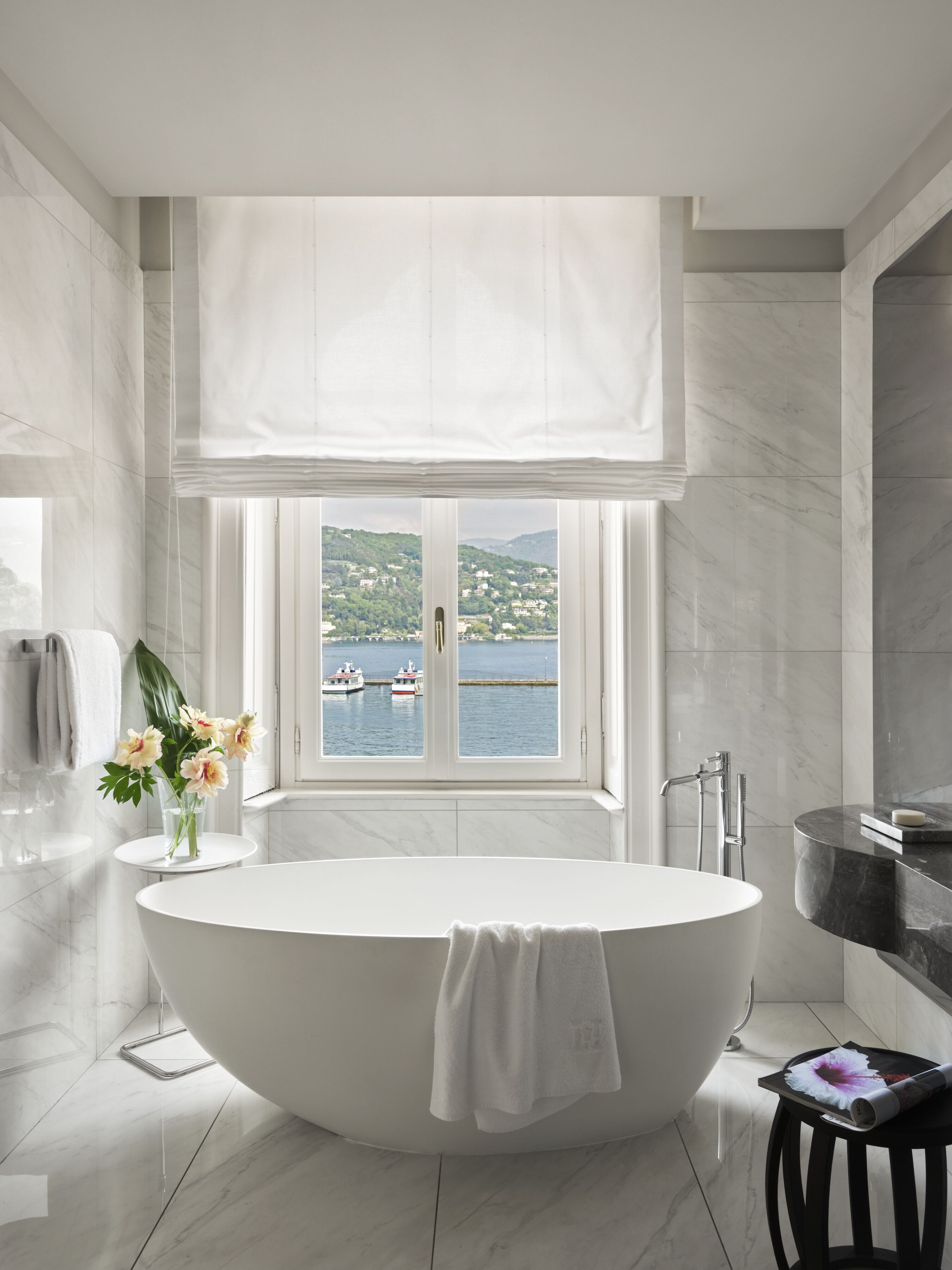 suite, lake view | bathroom | hair dryer, bathrobes, slippers, bidet