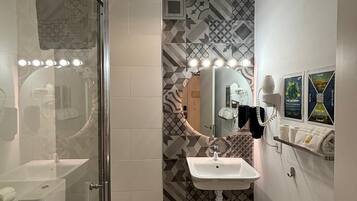 Panoramic Studio | Bathroom | Rainfall showerhead, hair dryer, towels, soap