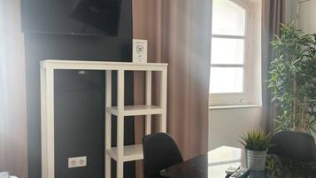 Deluxe Apartment, 2 Bedrooms | Living area | Smart TV