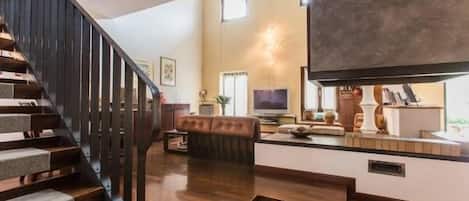 Apartment, 3 Bedrooms | Living area | Flat-screen TV, fireplace