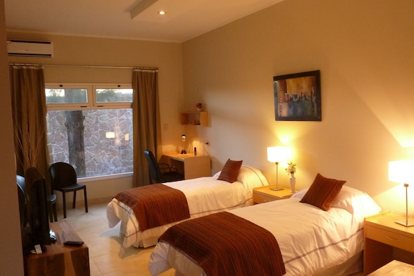 Executive Suite | Blackout drapes, iron/ironing board (on request), individually furnished