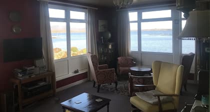 Right on the sea front bright bungalow with big secluded garden