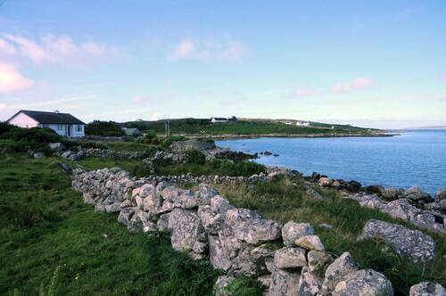 Right on the sea front bright bungalow with big secluded garden