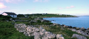 Right on the sea front bright bungalow with big secluded garden