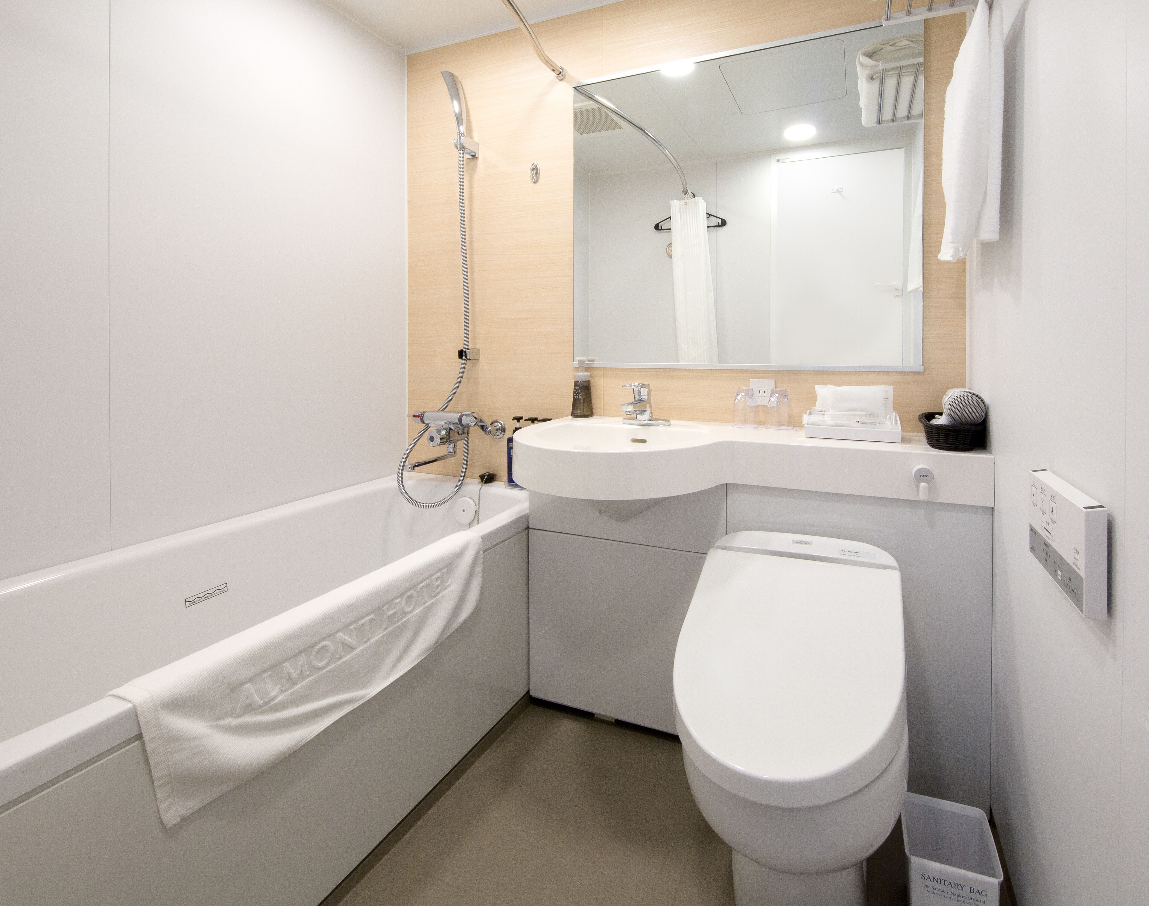 combined shower/bathtub, free toiletries, hair dryer, slippers