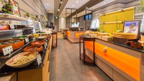 A buffet area with various food dishes and a counter with a menu display. - Almont Hotel Sendai (Sendai)