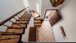 A spiral staircase with wooden railings and a tiled floor. - quiet farm to relax 1km from Son Macia (SON MACIA      MANACOR)