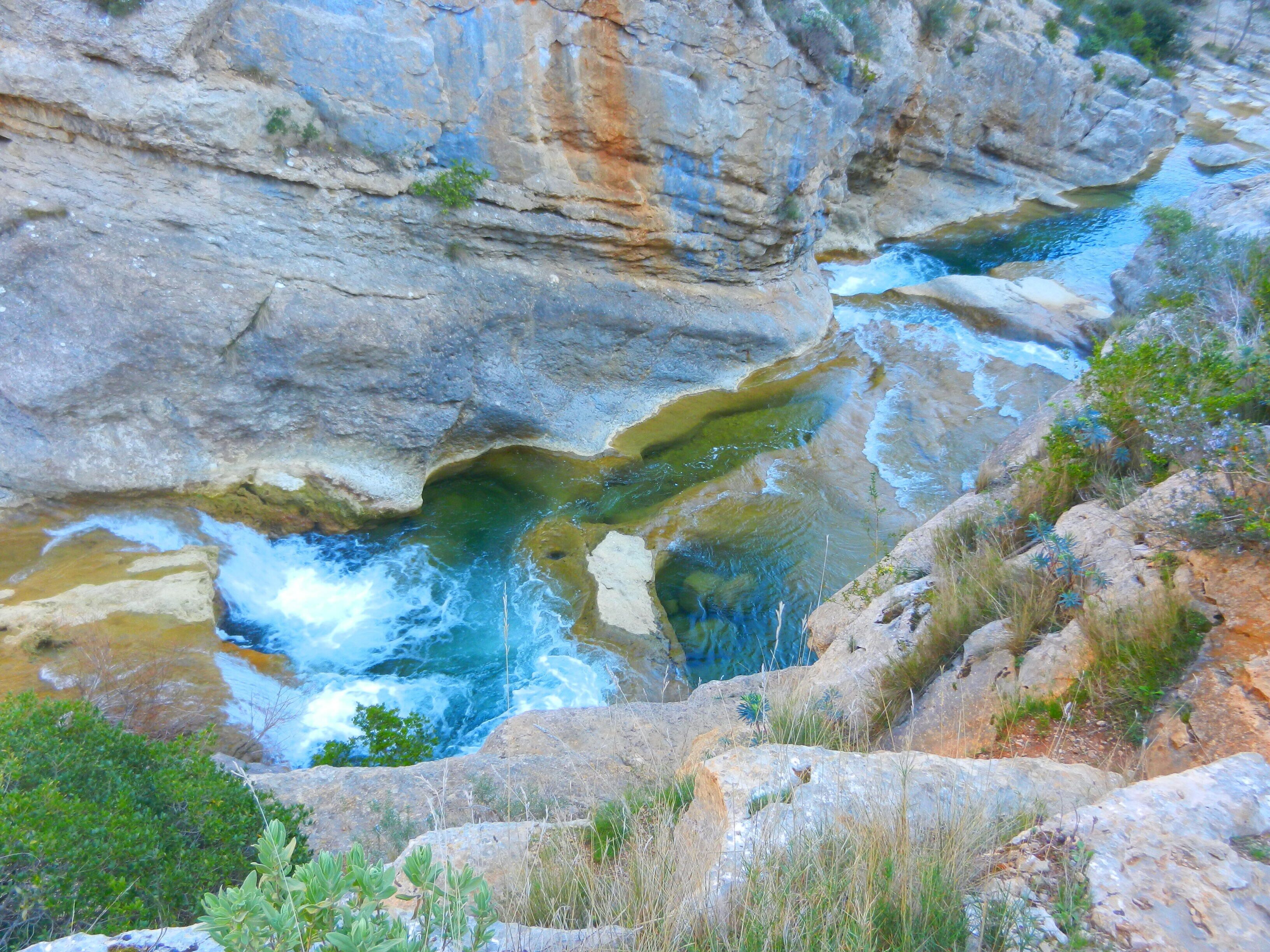 A natural rock formation with a cascading water feature.
