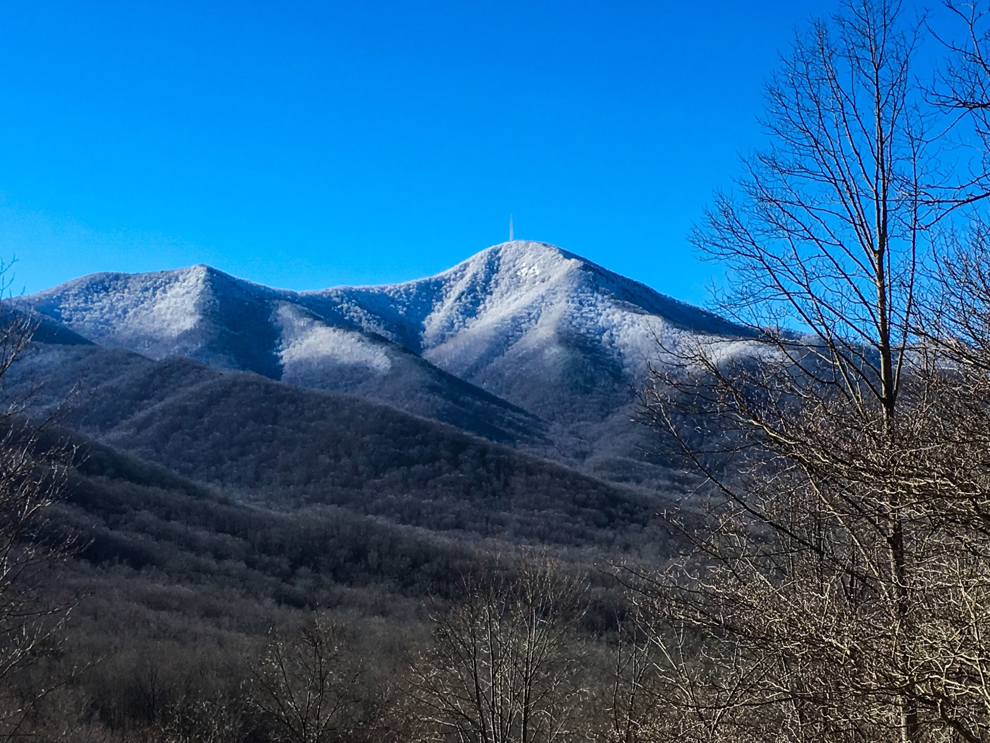 A mountain landscape with a clear sky.