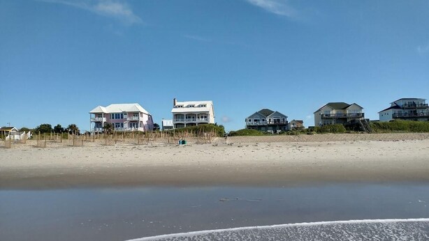 A beachfront property with multiple houses, a sandy beach, and a clear sky. - LAST MIN DISCOUNT LABOR DAY! 2nd ROW EASY beach access 1/2 block Ocean View (Emerald Isle)