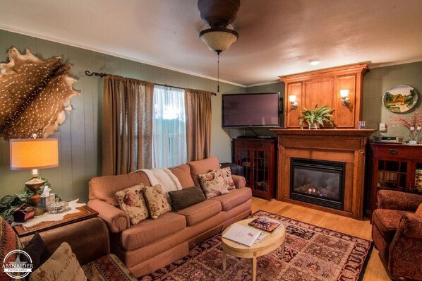 Smart TV, chimenea, reproductor de DVD y tenis de mesa 