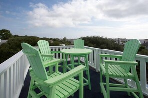 Sitting area on crow's nest on top of house.  Amazing sunset & sunrise views. 