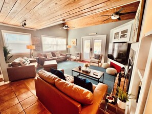 Smart TV, fireplace, books, computer monitors