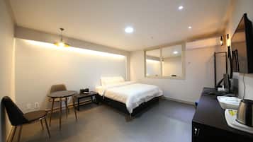 Premium bedding, pillow-top beds, desk, laptop workspace