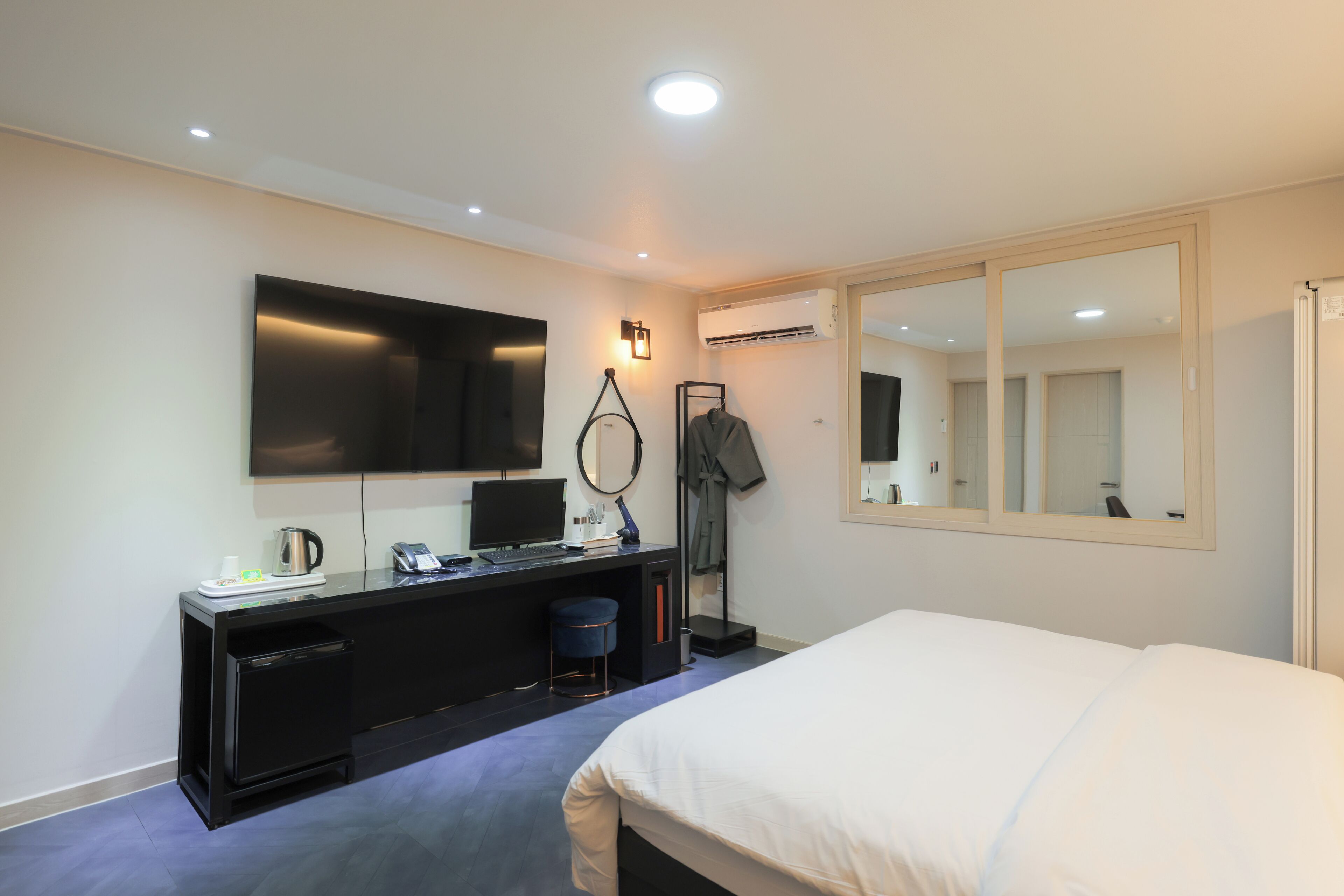 premium bedding, pillow-top beds, desk, laptop workspace