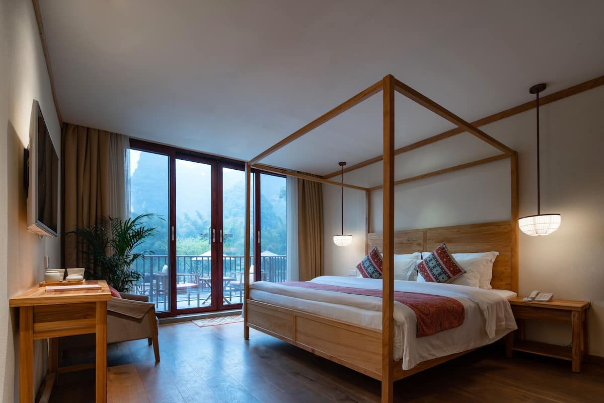Suite With Balcony, King | Free minibar, in-room safe, individually decorated, desk