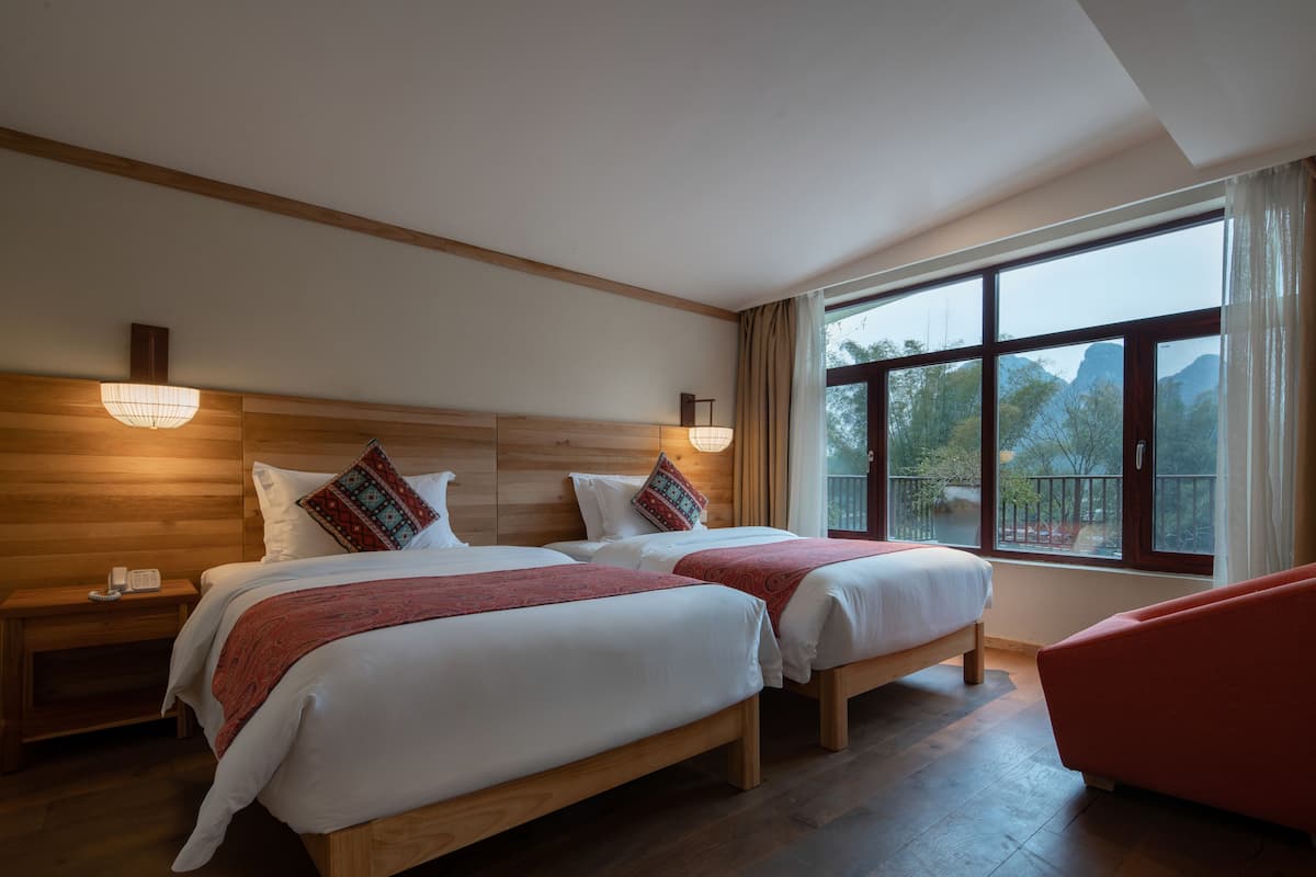 Family Suite with Balcony | Free minibar, in-room safe, individually decorated, desk