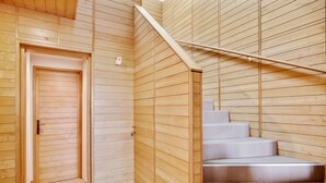 A wooden interior with a staircase leading to a second floor. - Logis DE Valandraud (Saint-Etienne-De-Lisse)